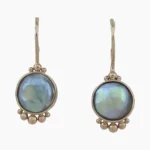A pair of natural abalone pearl shepards hook style earrings with rare granulation accents from Mendocino, California measuring 9mm. Set in 14-karat yellow gold.