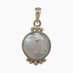 Pendant with a natural abalone pearl measuring 12mm round from Mendocino, California. Set in solid 14-karat yellow gold .