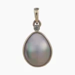 Pendant with a natural abalone pearl from Mendcino, California. Pear-shaped, measuring 13 x 11mm set in 14-karat yellow gold with a 2mm round 0.03-carat VS1G accent diamond at the top.
