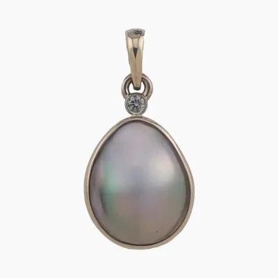 Pendant with a natural abalone pearl from Mendcino, California. Pear-shaped, measuring 13 x 11mm set in 14-karat yellow gold with a 2mm round 0.03-carat VS1G accent diamond at the top.