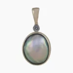 Pendant with natural oval-shaped abalone pearl from Mendocino, California measuring 12 x 9mm set in 14-karat yellow gold with a 2mm round 0.03-carat VS1G quality diamond.