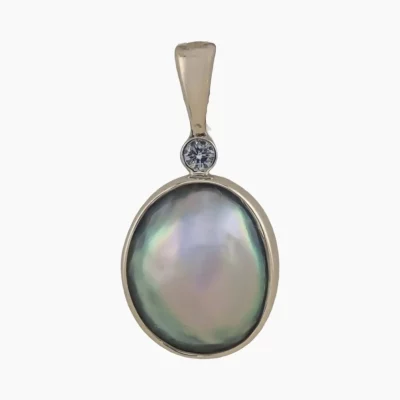 Pendant with natural oval-shaped abalone pearl from Mendocino, California measuring 12 x 9mm set in 14-karat yellow gold with a 2mm round 0.03-carat VS1G quality diamond.