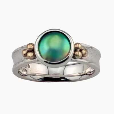 Ring with a natural 9mm abalone pearl from Northern California, set in sterling silver with solid 14-karat yellow gold accents.