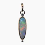 Pendant with a 2.64-carat Australian Andamooka pear-shaped opal measuring 20 x 7mm, accented with two 2.2mm round diamonds (TW) 0.07-carats set in solid 14-karat yellow gold.
