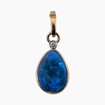 Pendant with a 2.71-carat pear-shaped opal from Coober Pedy, Australia measuring 14 x 10mm set in 14-karat solid yellow gold with a 2mm round VS1G0.03-carat diamond set in a 14-karat white gold bezel