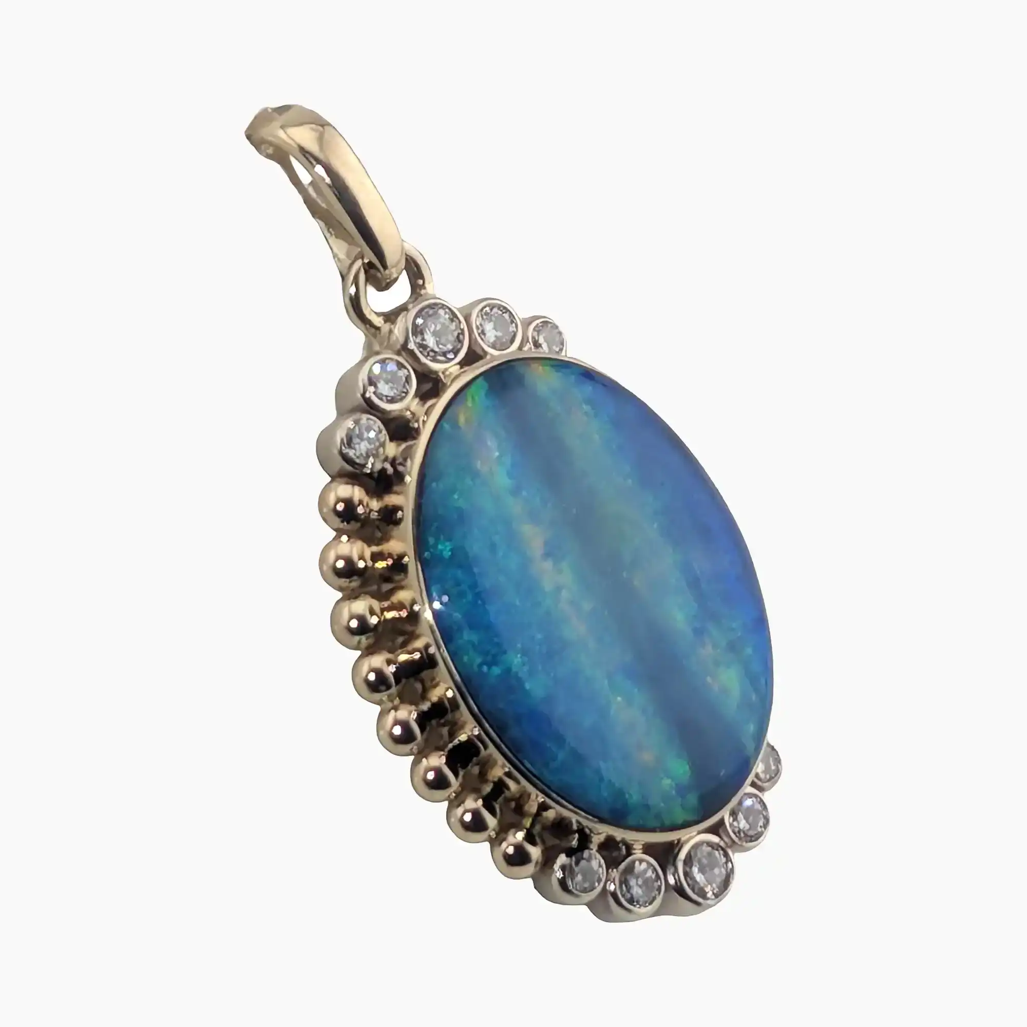 Pendant featuring a 4.22-carot oval opal from Andamooka Austrailia, measuring 18 x 14mm. Set in 14-karat yellow gold with 10 2mm round VS1G diamonds (Total weight 0.32-carats) bezel set on each side.