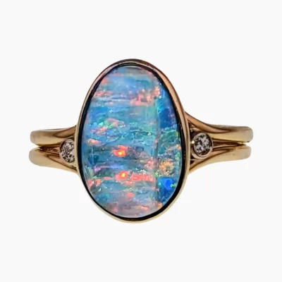 Ring with a 3.26-carat opal measuring 13 x 9mm from Lambina, Australia set in 14-karat yellow gold with two 0.02-carat round VS1G diamonds measuring 1.7mm.