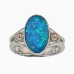 Ring with a 1.88-carat oval opal from Lambina, Australia measuring 9 x14mm set in sterling silver with solid 14-karat yellow gold accents.
