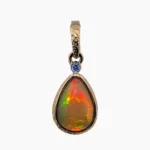 Pendant with a 1.96-carat Eithyopian opal, pear-shaped, measuring 12 x 9mm set in solid 14 karat yellow gold with a 0.02-carat accent diamond.