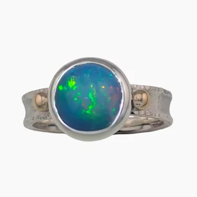 Ring with an Ethiopian 11mm round 2.26-carat opal set in sterling silver with solid 14-karat yellow gold accents.