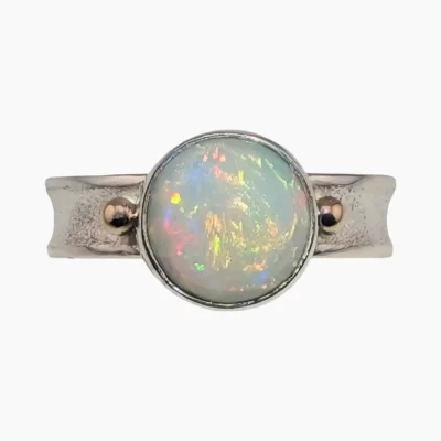 Ring set with a 1.86-carat 10mm round Ethiopian opal set in sterling silver with solid 14-karat yellow gold accents.