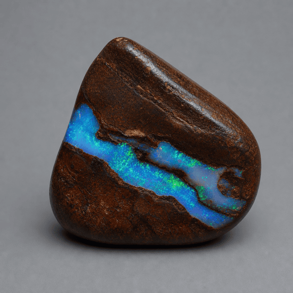 Boulder opal showing color against brown ironstone