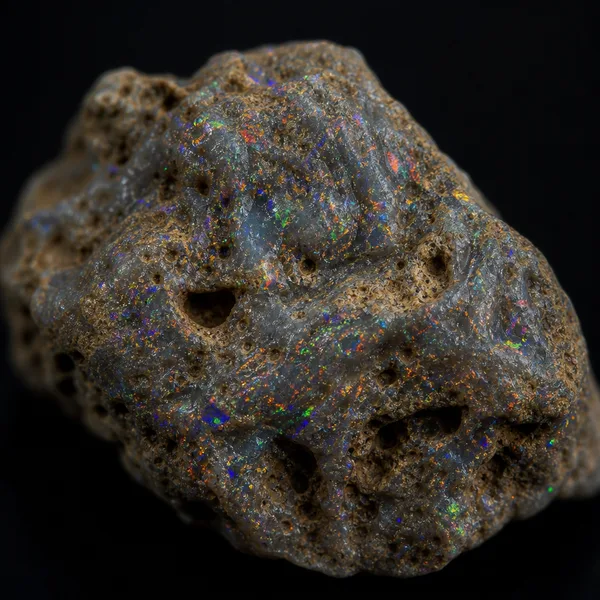 Matrix opal with color scattered through a porous host rock rather than forming a solid seam