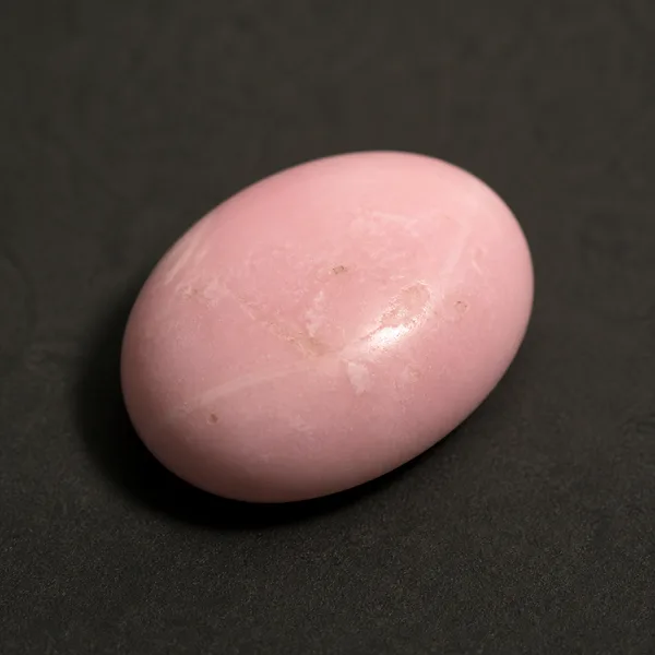 Natural Peruvian pink opal cabochon with a pale, chalky bubblegum-pink body and no play-of-color