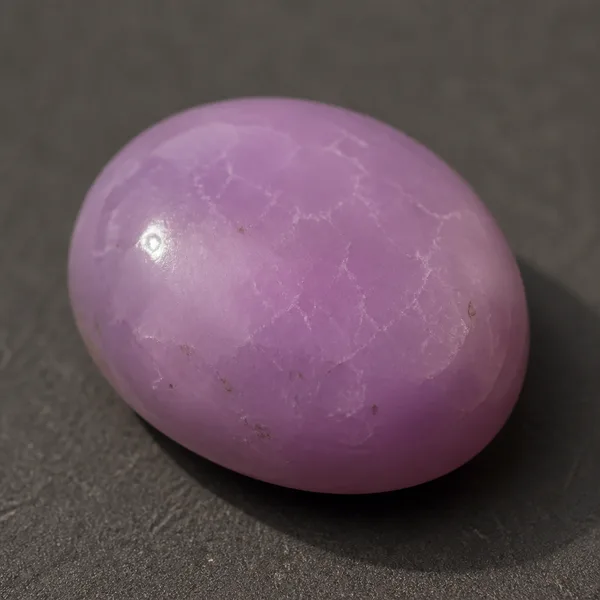 Natural Peruvian purple morado opal cabochon with a lavender to mauve body and no play-of-color