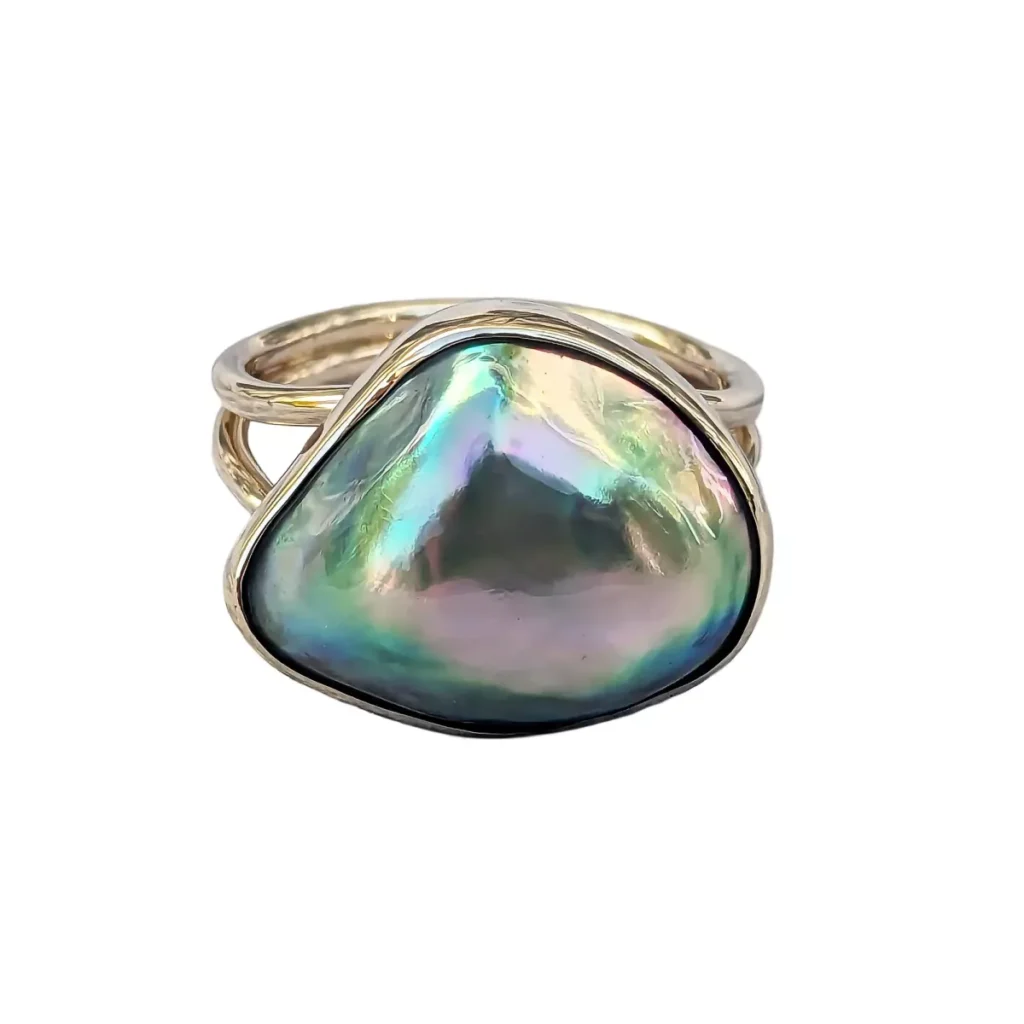 Abalone mabe pearl ring in a gold split-shank setting