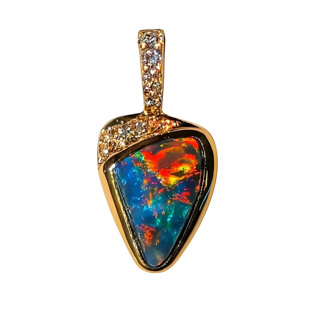 Triangular dark opal pendant with red and orange fire, hung from a diamond pave gold bail