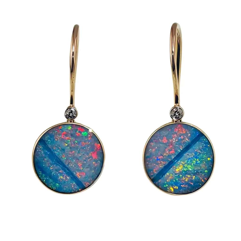 Opal dangle earrings in gold with bezel-set diamond accents